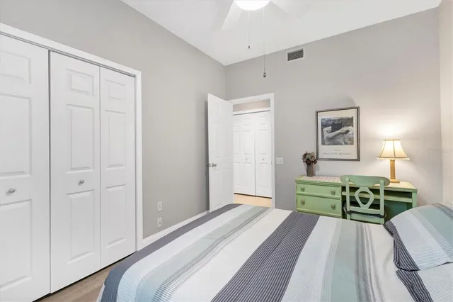 a bedroom with a bed and a table in it