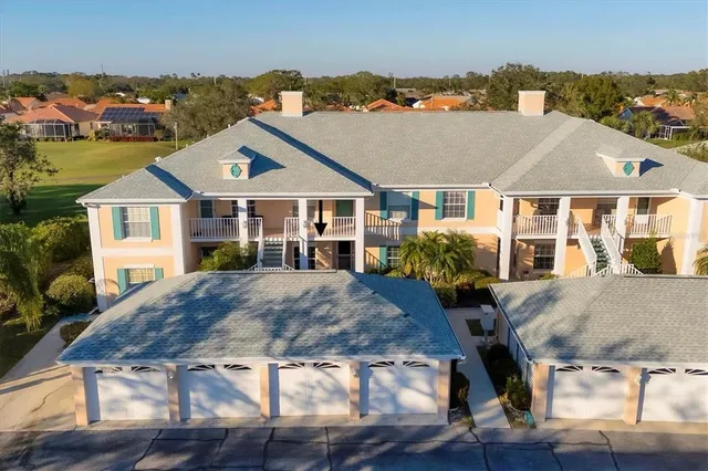 a aerial view of a house with table and chairs