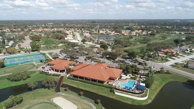 an aerial view of a house with a lake view