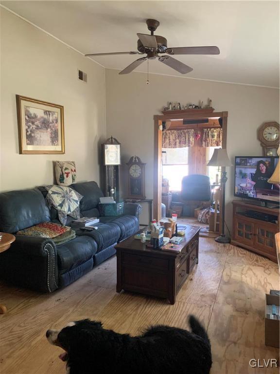 542 Norman Road Nazareth, PA 18064 - Photo 11 of 23 a living room with furniture a ceiling fan and a window