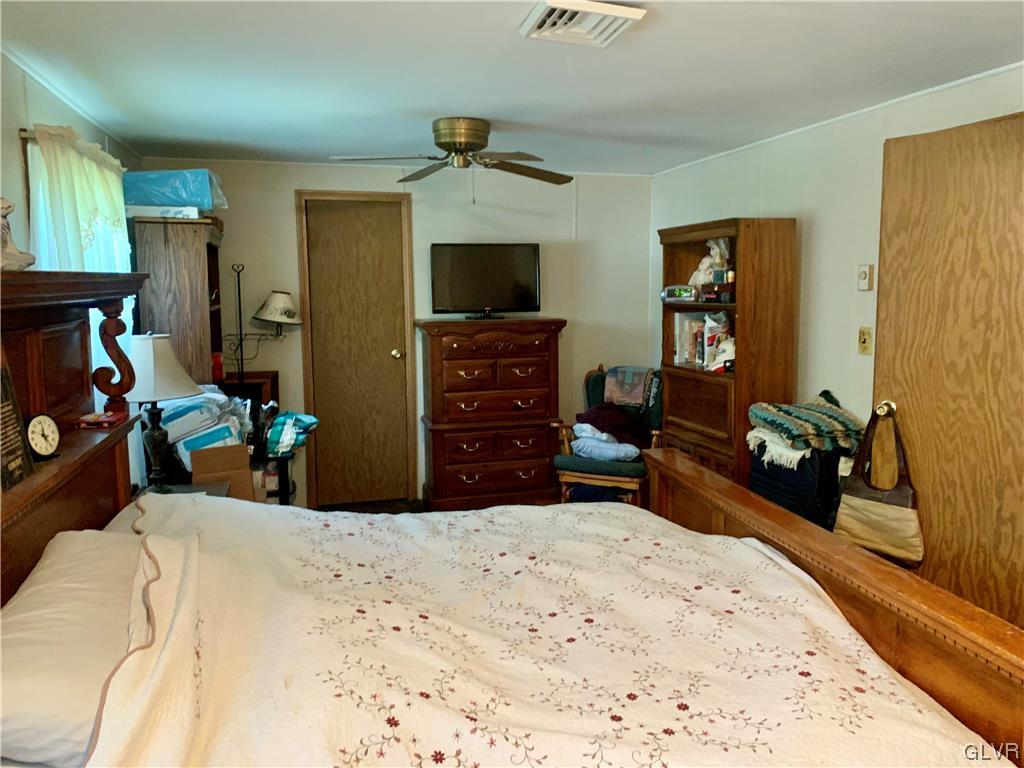 542 Norman Road Nazareth, PA 18064 - Photo 14 of 23 a bed room with a bed and a television