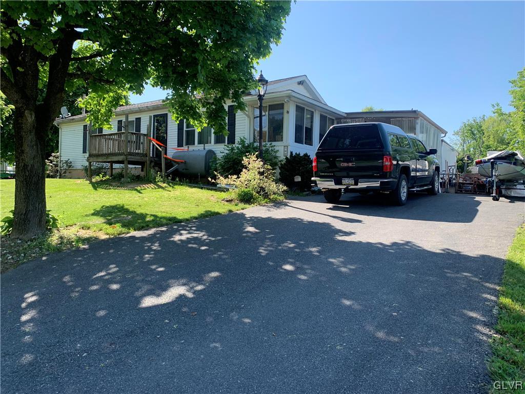 542 Norman Road Nazareth, PA 18064 - Photo 2 of 23 a house view with a sitting space and garden