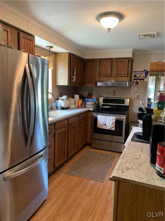 542 Norman Road Nazareth, PA 18064 - Photo 9 of 23 a kitchen with stainless steel appliances granite countertop a refrigerator a stove and a sink