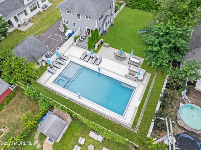 an aerial view of a house with a garden
