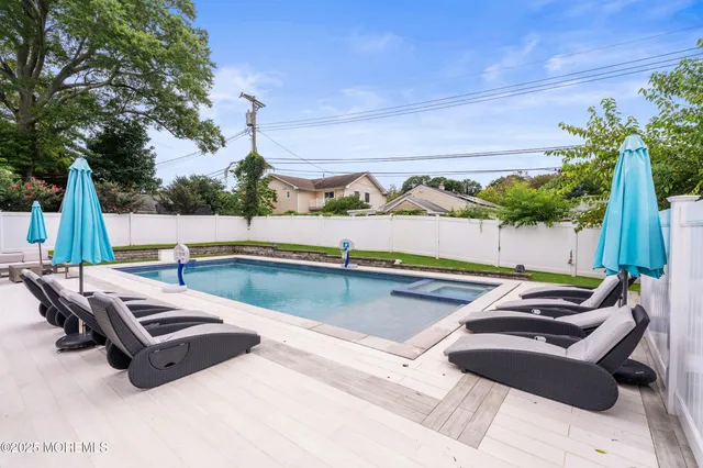 a view of a backyard with chairs