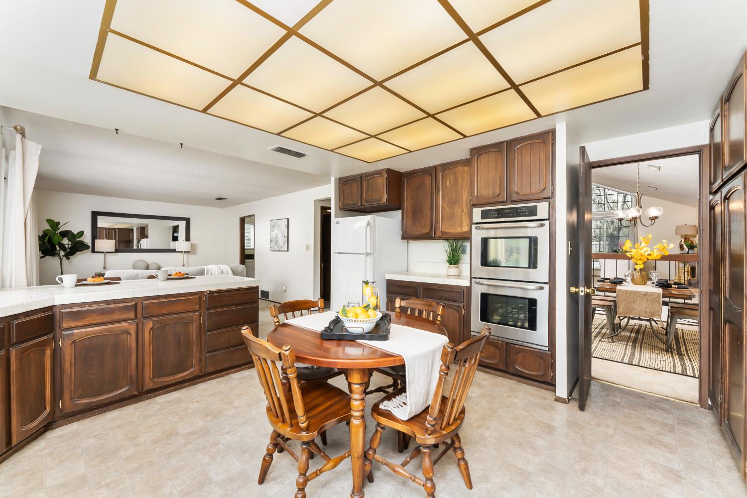3126 Oxford Road Cameron Park, CA 95682 - Photo 14 of 45 a kitchen with stainless steel appliances kitchen island granite countertop a sink and cabinets