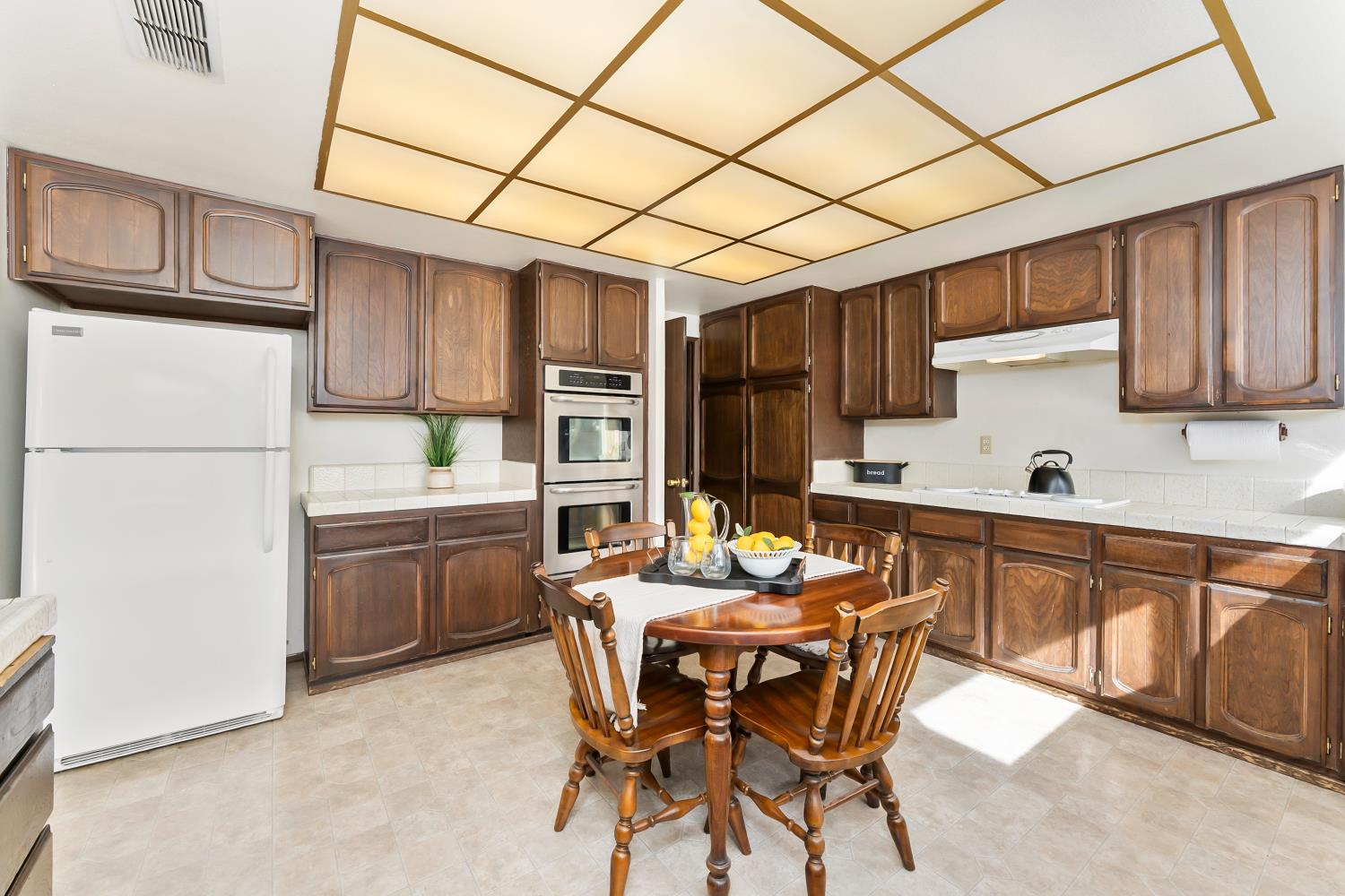 3126 Oxford Road Cameron Park, CA 95682 - Photo 15 of 45 a kitchen with stainless steel appliances granite countertop a sink refrigerator and cabinets