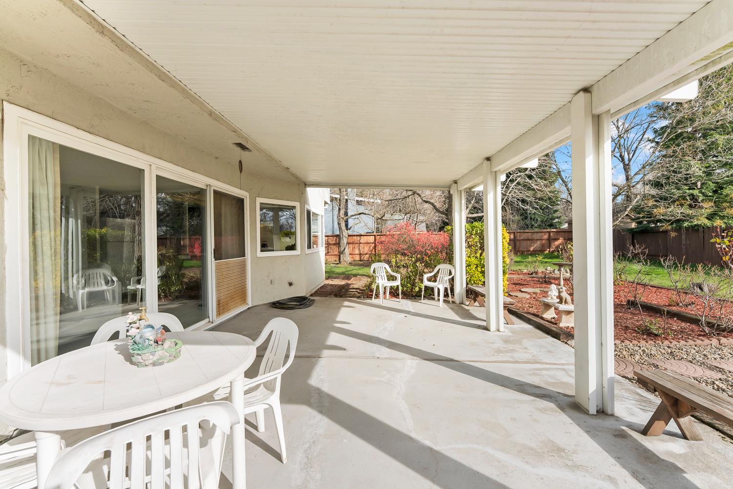 3126 Oxford Road Cameron Park, CA 95682 - Photo 31 of 45 a dining room with furniture and a floor to ceiling window
