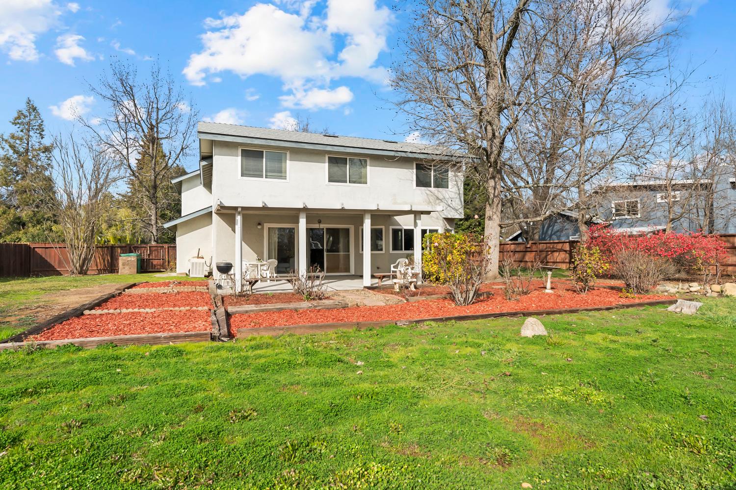 3126 Oxford Road Cameron Park, CA 95682 - Photo 39 of 45 a view of a house with a yard and sitting area