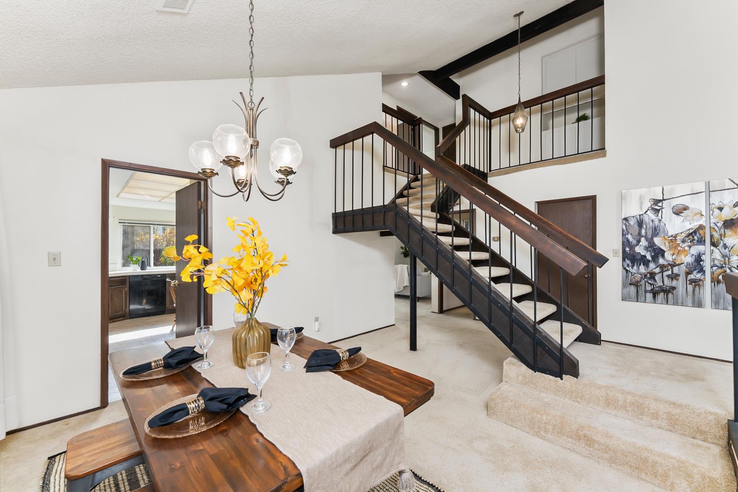 3126 Oxford Road Cameron Park, CA 95682 - Photo 7 of 45 a living room with couches a dining table and chairs with wooden floor