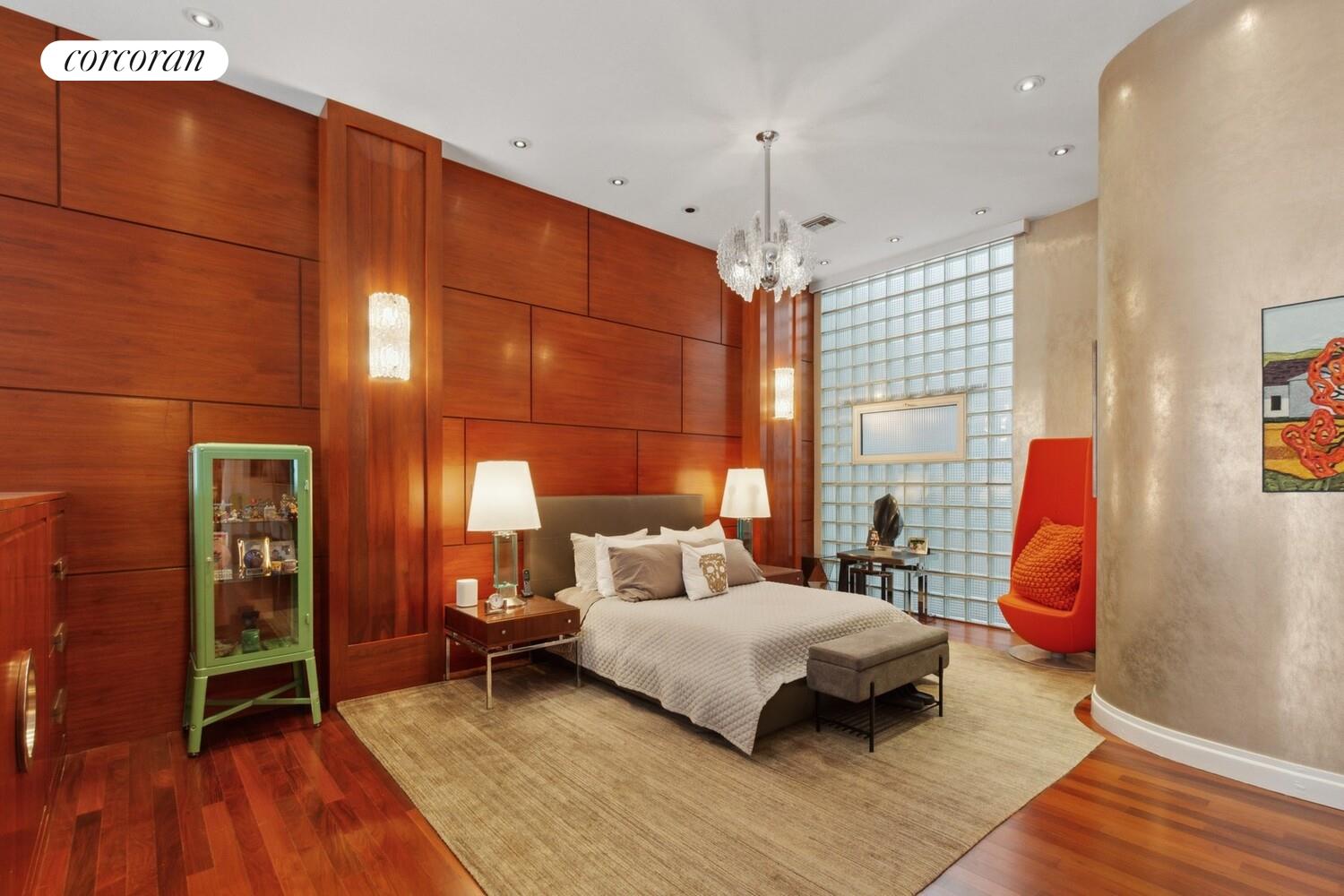 253 West 73rd Street, Unit 5F Manhattan, NY 10023 - Photo 10 of 19 a bedroom with a bed and a chandelier