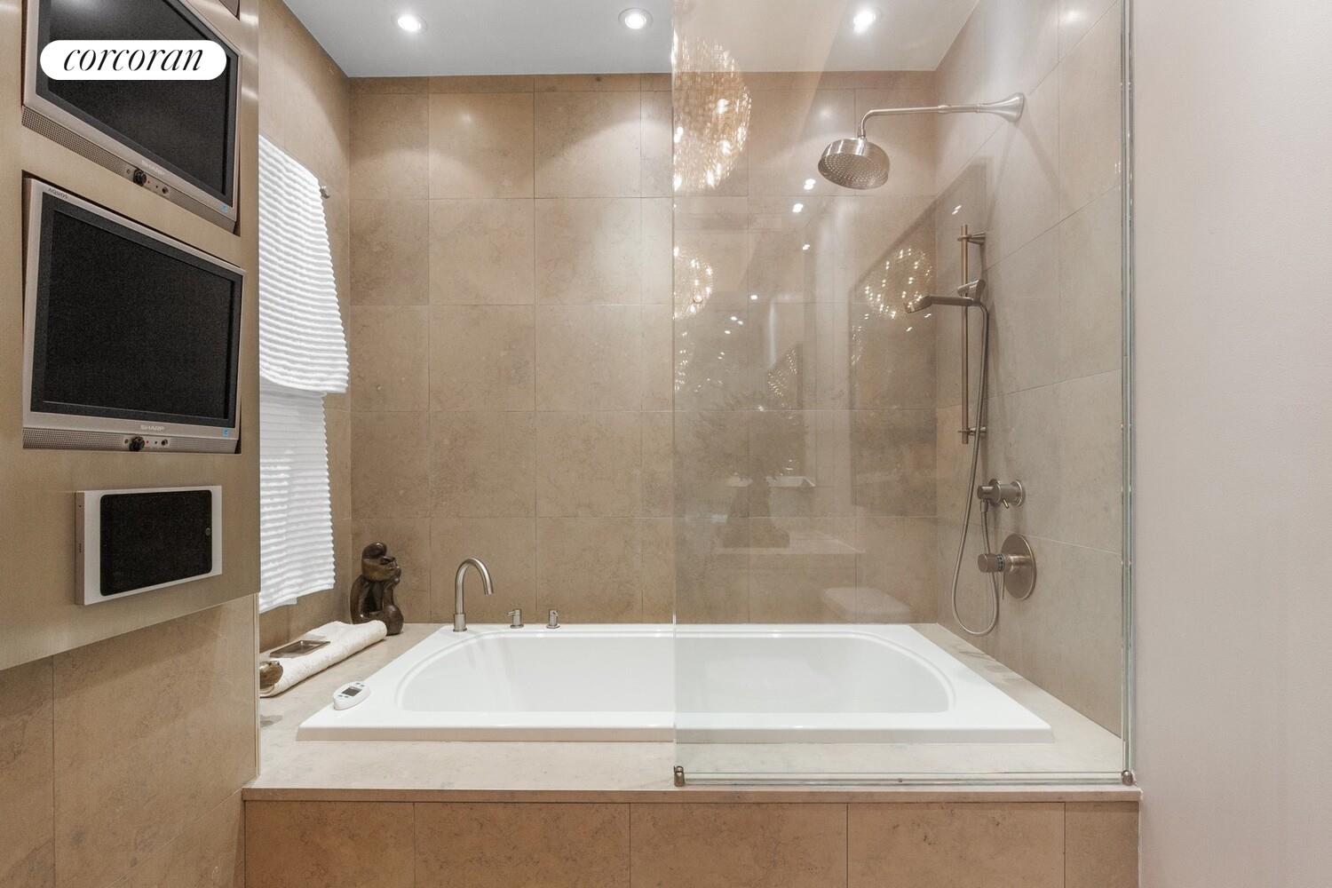 253 West 73rd Street, Unit 5F Manhattan, NY 10023 - Photo 12 of 19 a bathroom with a bathtub and a shower