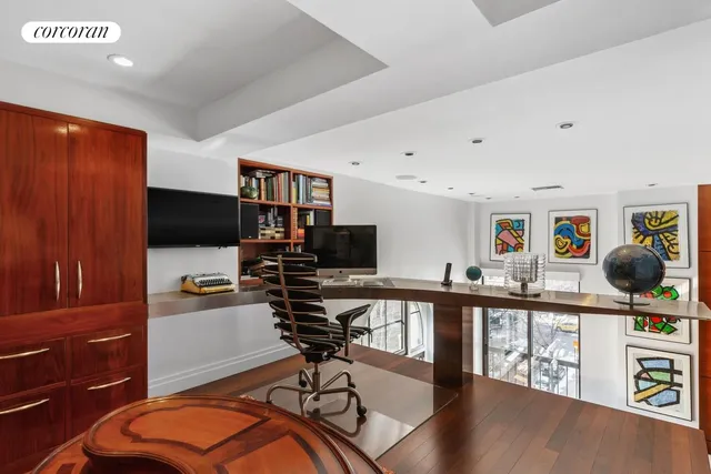 a living room with furniture and flat screen tv