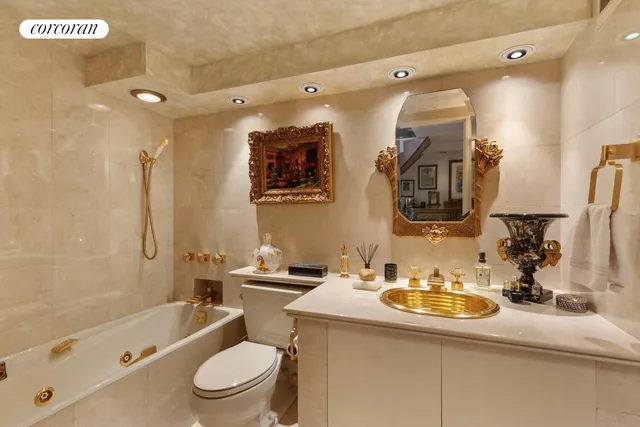 a bathroom with a granite countertop sink mirror toilet and bathtub