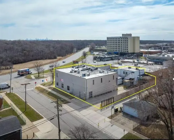 a view of a balcony with two chairs and a stove