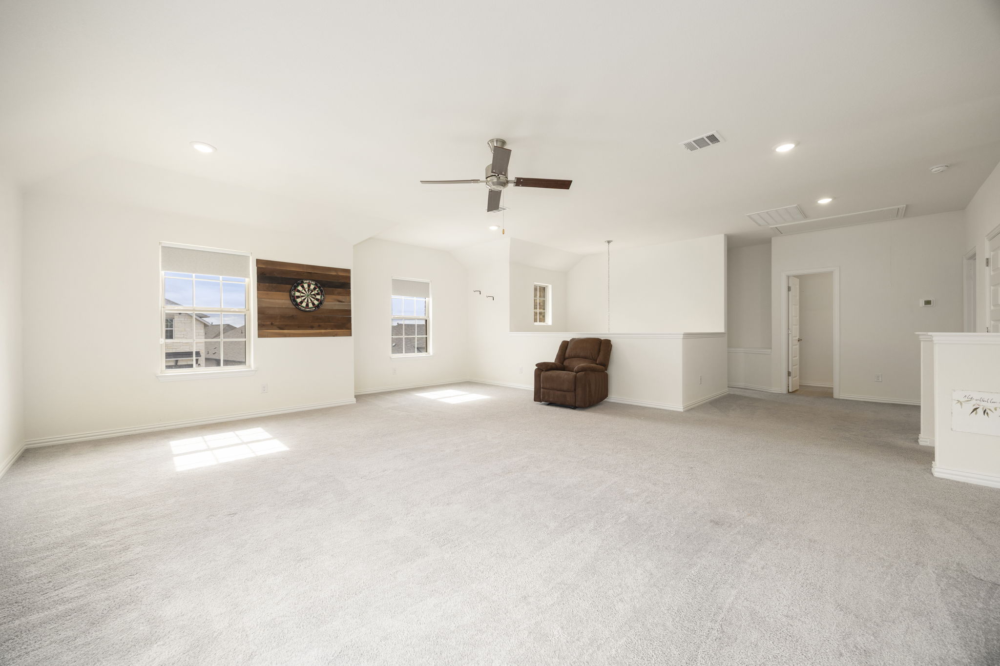 1098 Cherrystone Loop Buda, TX 78610 - Photo 22 of 37 a view of a livingroom with furniture and a ceiling fan