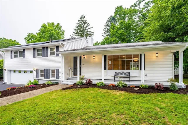 front view of a house with a yard