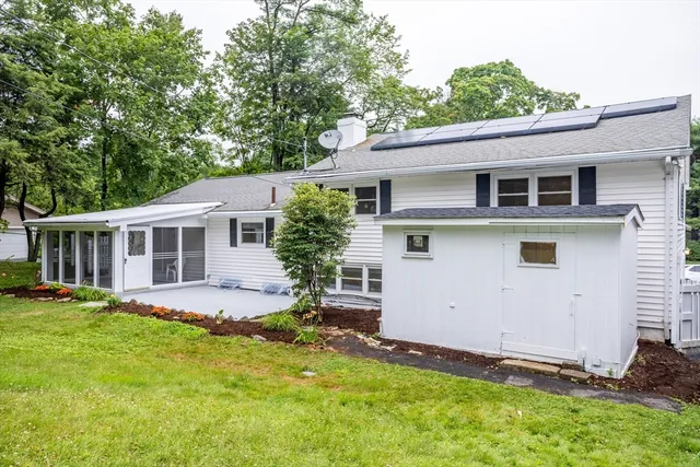 a view of a house with a yard