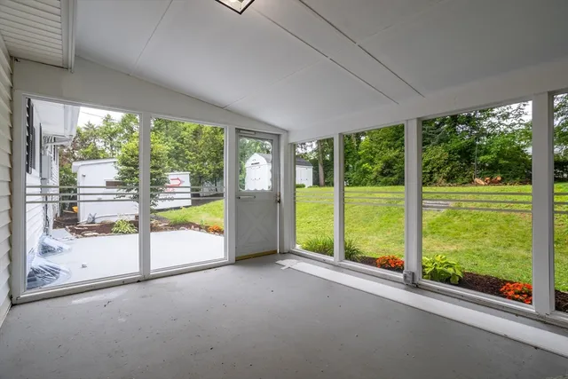 a view of a room with yard and balcony