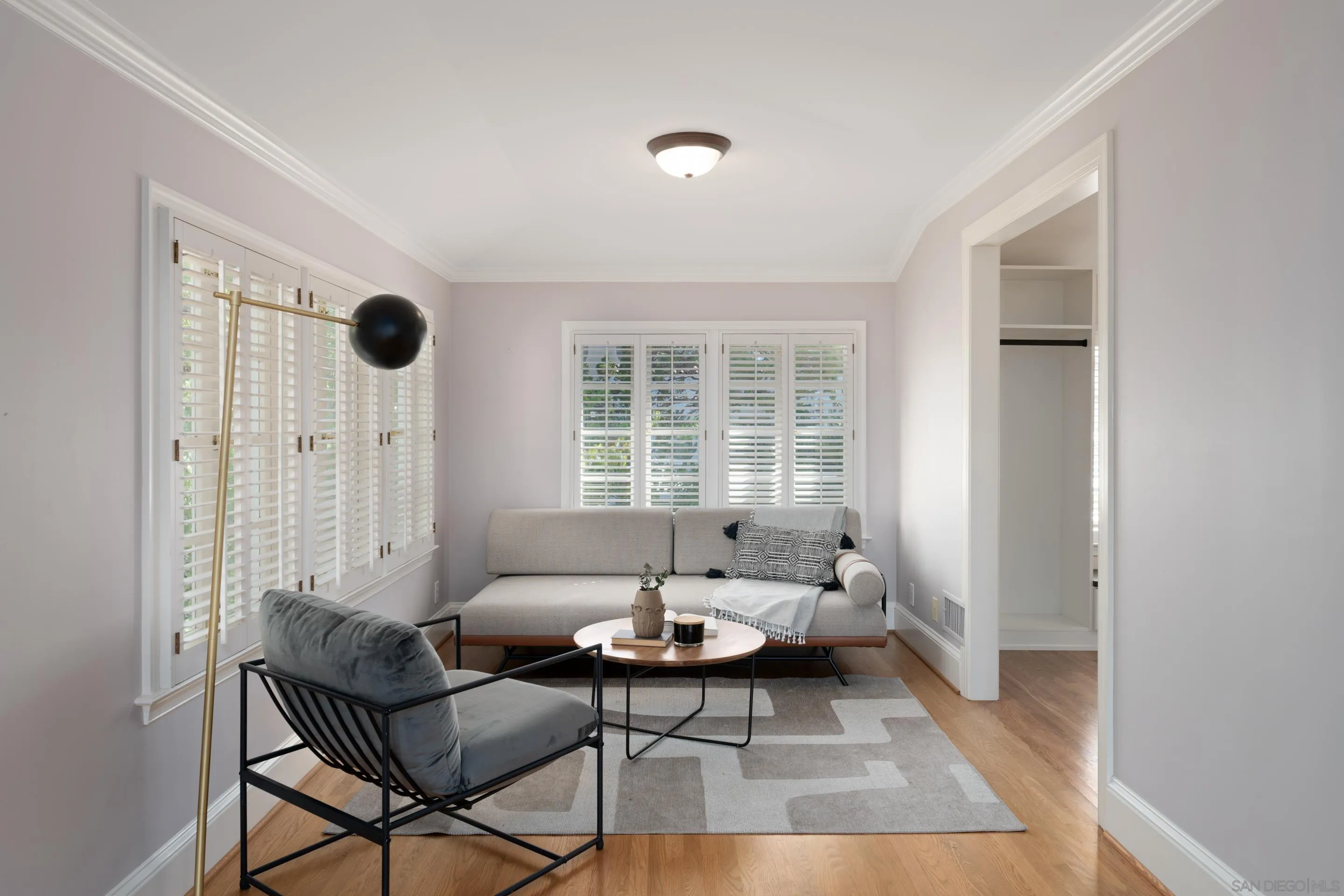 1506 Plumosa Way San Diego, CA 92103 - Photo 13 of 30 a living room with furniture and a floor to ceiling window