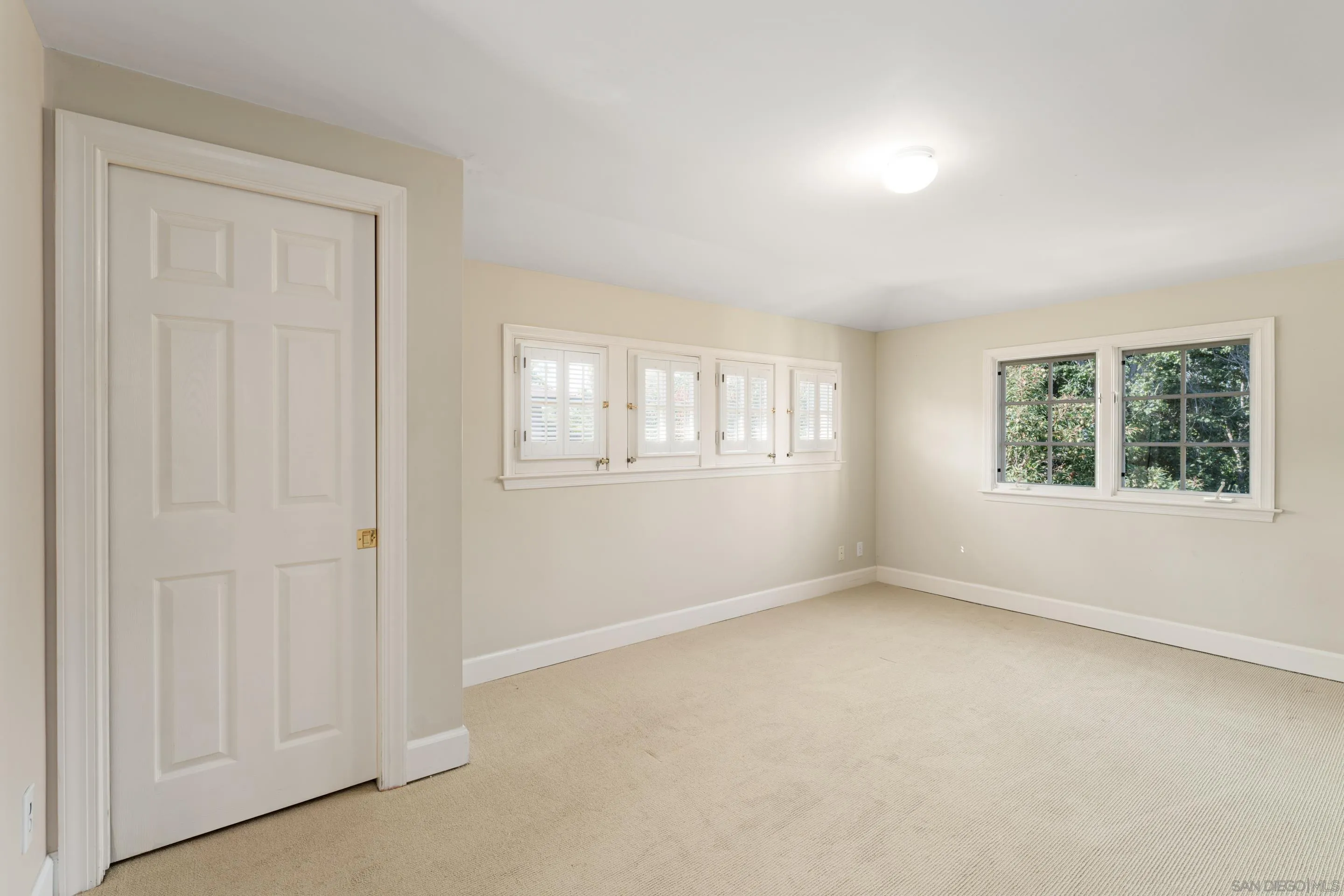 1506 Plumosa Way San Diego, CA 92103 - Photo 15 of 30 an empty room with windows