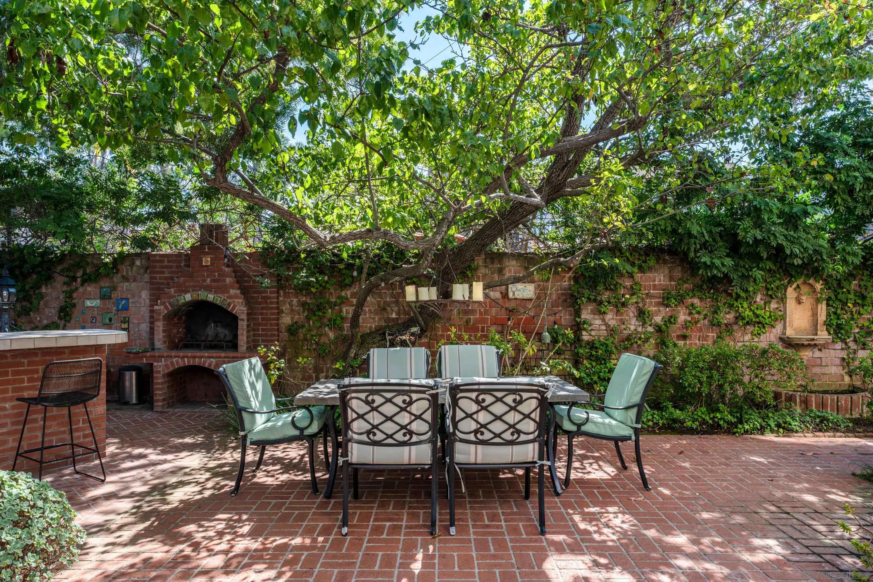 1506 Plumosa Way San Diego, CA 92103 - Photo 22 of 30 a view of a patio with table and chairs and potted plants