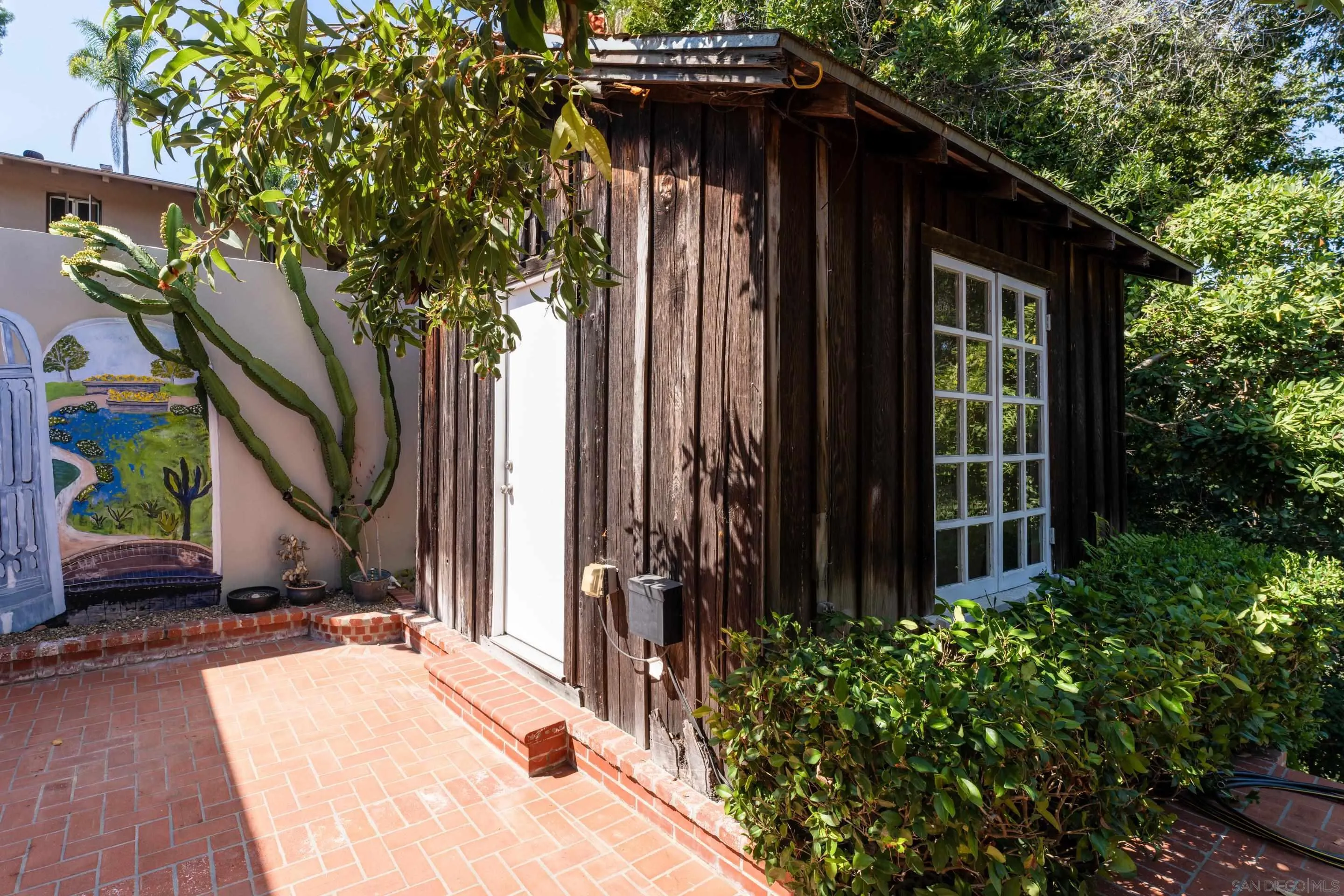 1506 Plumosa Way San Diego, CA 92103 - Photo 28 of 30 a view of a house with a small yard plants and large tree