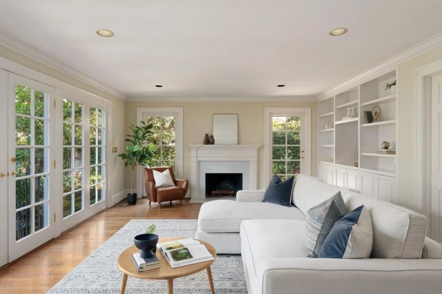 a living room with furniture and a fireplace