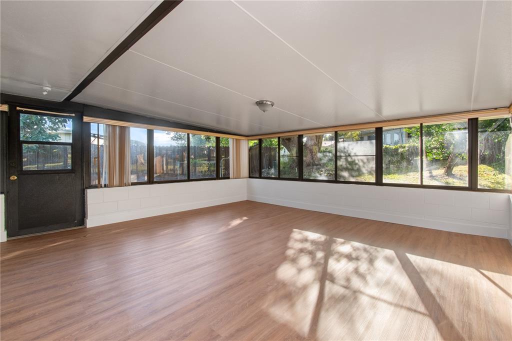 304 Barclay Avenue Altamonte Springs, FL 32701 - Photo 27 of 29 wooden floor in an empty room with a window