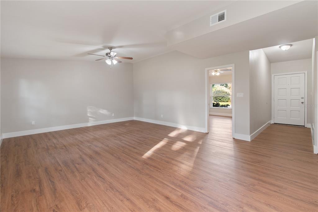304 Barclay Avenue Altamonte Springs, FL 32701 - Photo 6 of 29 a view of empty room with wooden floor