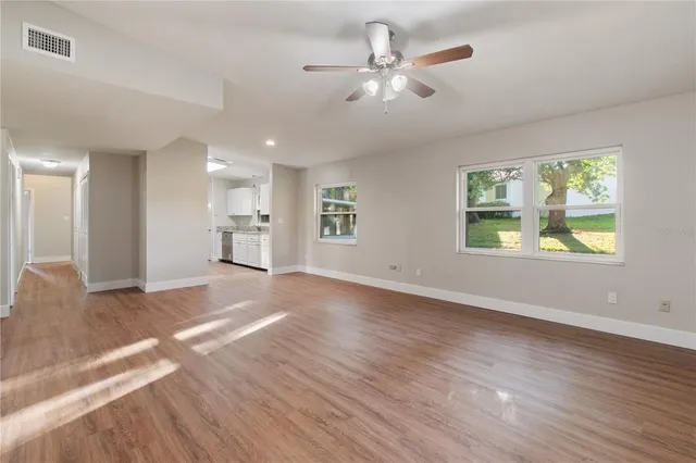 a view of an empty room with a window