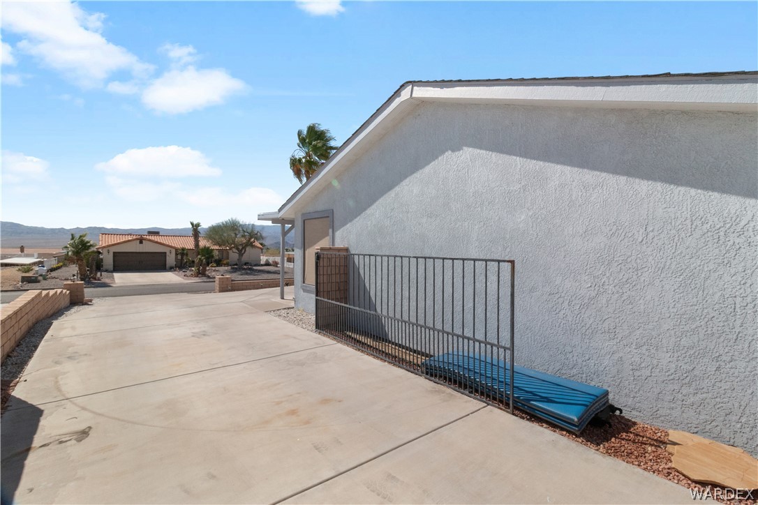 784 Pegasus Ranch Road Bullhead City, AZ 86429 - Photo 72 of 100 Stucco exterior with a pitched roofline