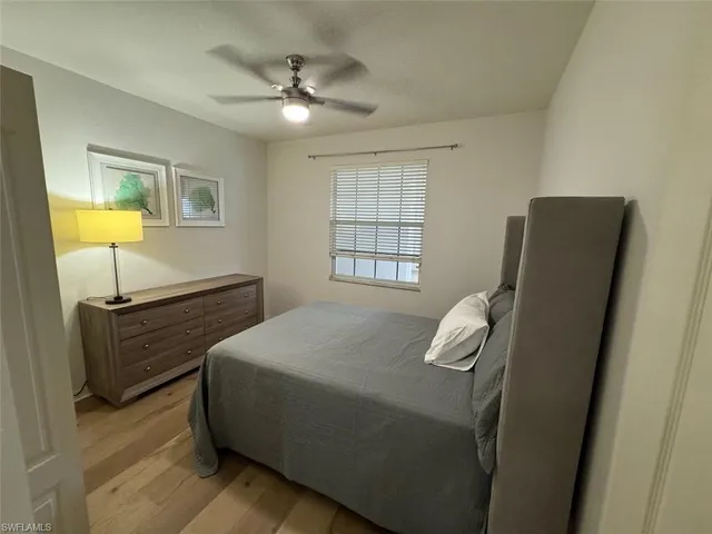 a kitchen with stainless steel appliances granite countertop a sink a stove a refrigerator cabinets and a dining table