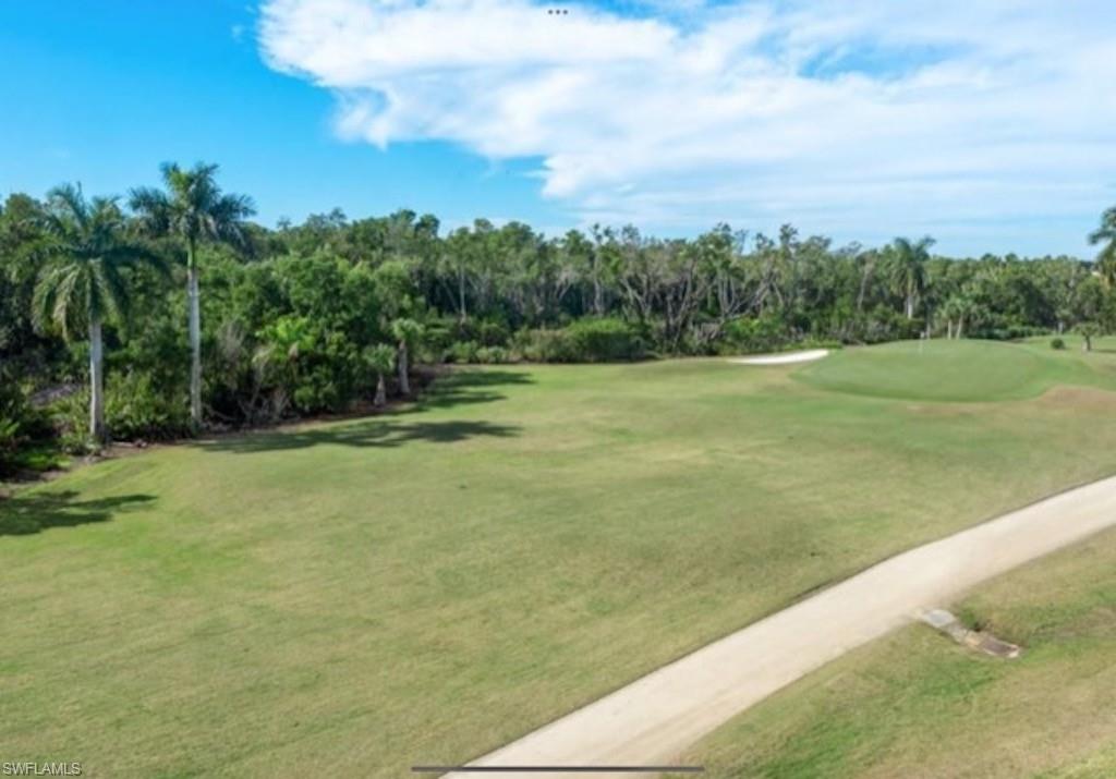 4650 Yacht Harbor Drive, Unit 132 Naples, FL 34112 - Photo 13 of 22 a view of an outdoor space and a yard