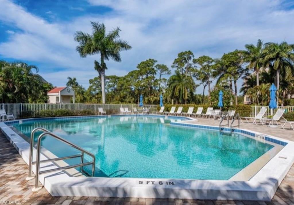 4650 Yacht Harbor Drive, Unit 132 Naples, FL 34112 - Photo 15 of 22 a view of a swimming pool with a patio