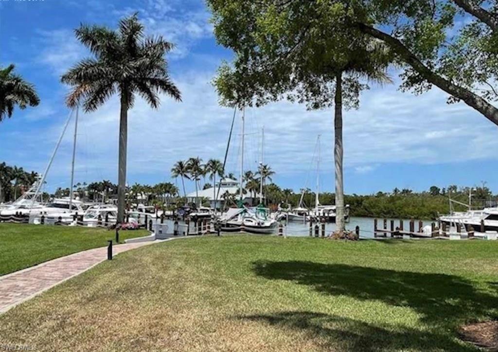 4650 Yacht Harbor Drive, Unit 132 Naples, FL 34112 - Photo 17 of 22 a view of a park with palm trees