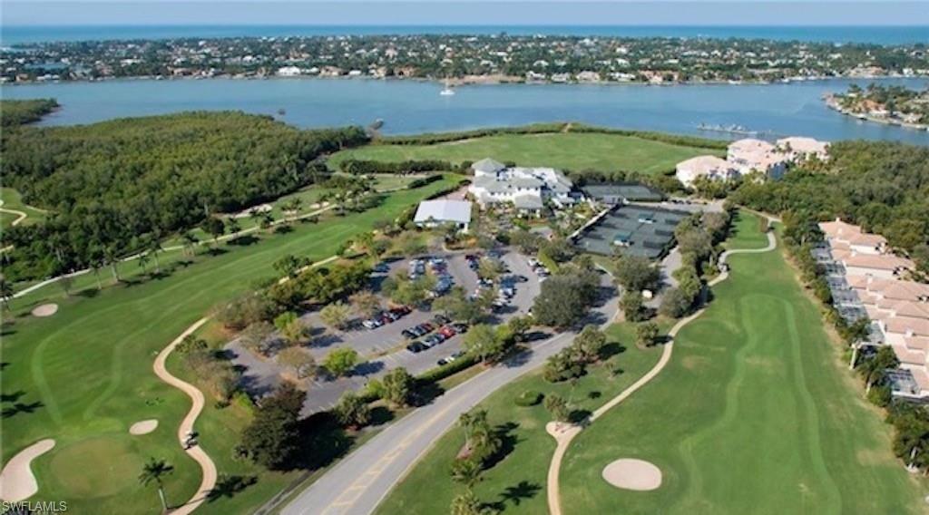 4650 Yacht Harbor Drive, Unit 132 Naples, FL 34112 - Photo 20 of 22 a view of a lake with a city