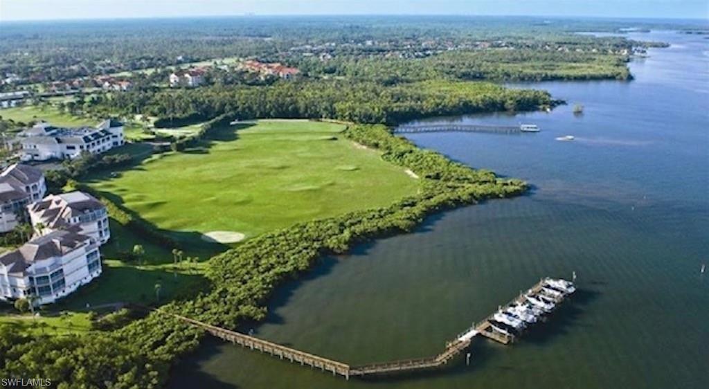 4650 Yacht Harbor Drive, Unit 132 Naples, FL 34112 - Photo 21 of 22 an aerial view of a golf course with parking space