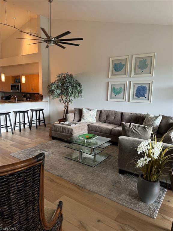 4650 Yacht Harbor Drive, Unit 132 Naples, FL 34112 - Photo 4 of 22 a living room with furniture and a potted plant