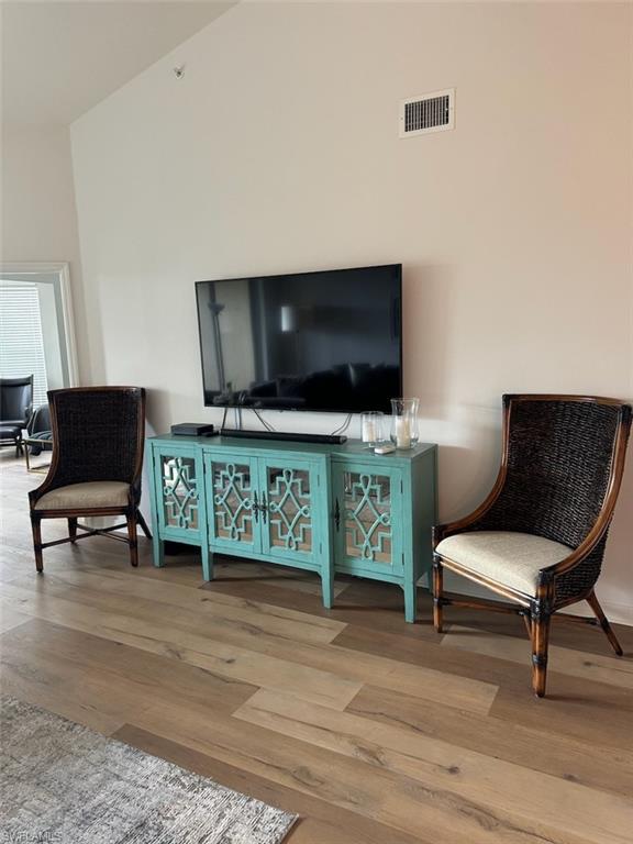 4650 Yacht Harbor Drive, Unit 132 Naples, FL 34112 - Photo 5 of 22 a living room with furniture and a flat screen tv