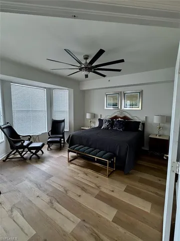 a bed room with furniture and a window