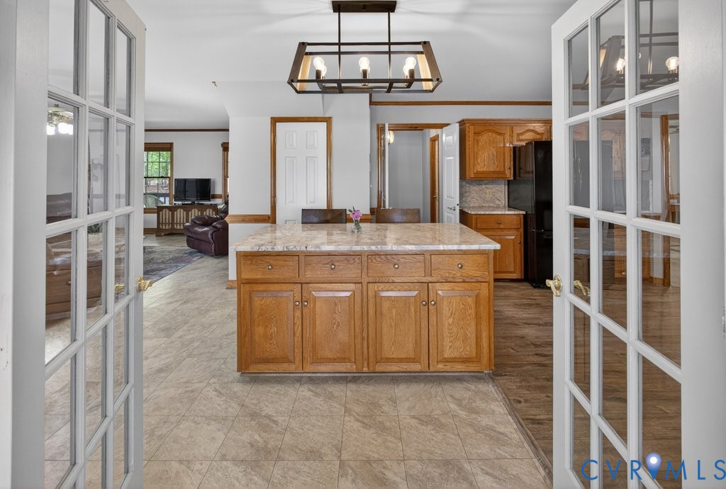 173 Covenant Way Bumpass, VA 23024 - Photo 11 of 55 The kitchen features a center island with a granit