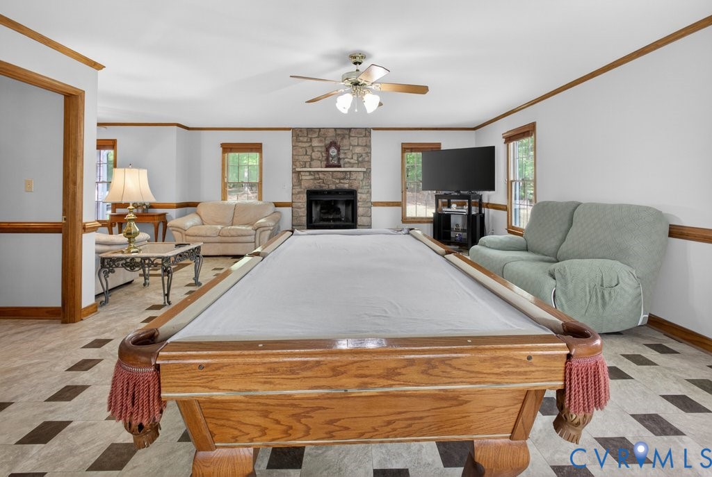 173 Covenant Way Bumpass, VA 23024 - Photo 18 of 55 a living room with furniture a fireplace and a flat screen tv