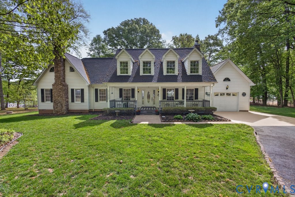 173 Covenant Way Bumpass, VA 23024 - Photo 2 of 55 The property features a well-maintained lawn, a st