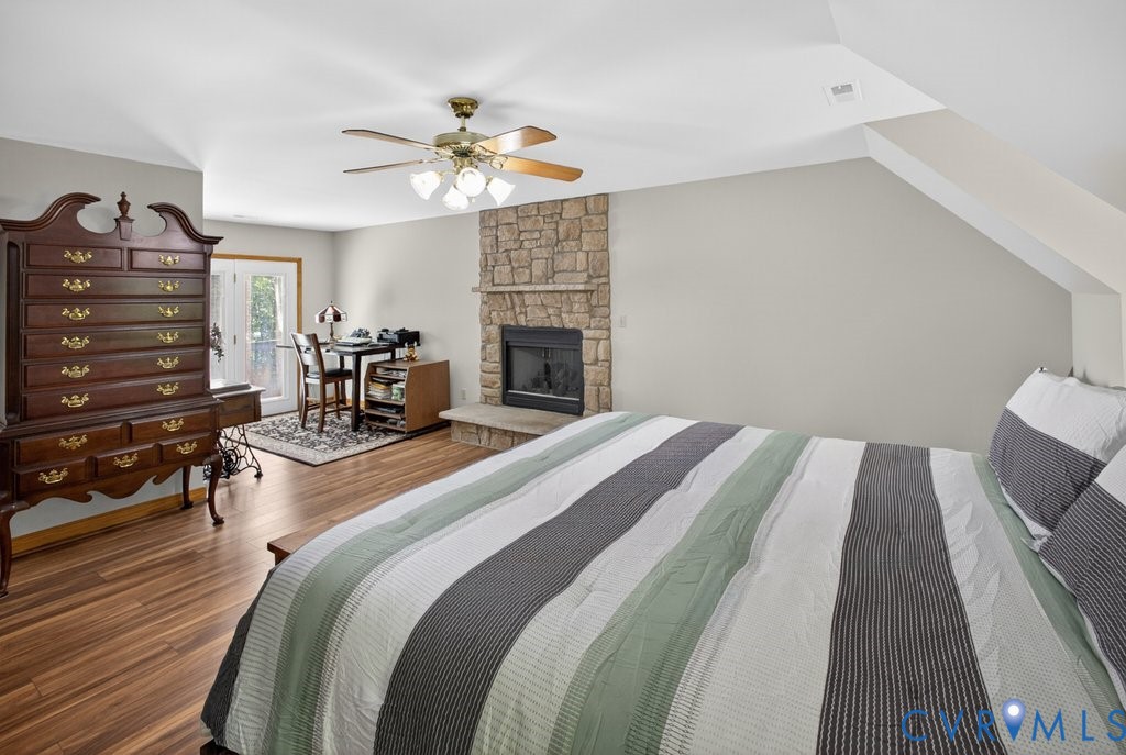 173 Covenant Way Bumpass, VA 23024 - Photo 29 of 55 a bedroom with bed and a chandelier