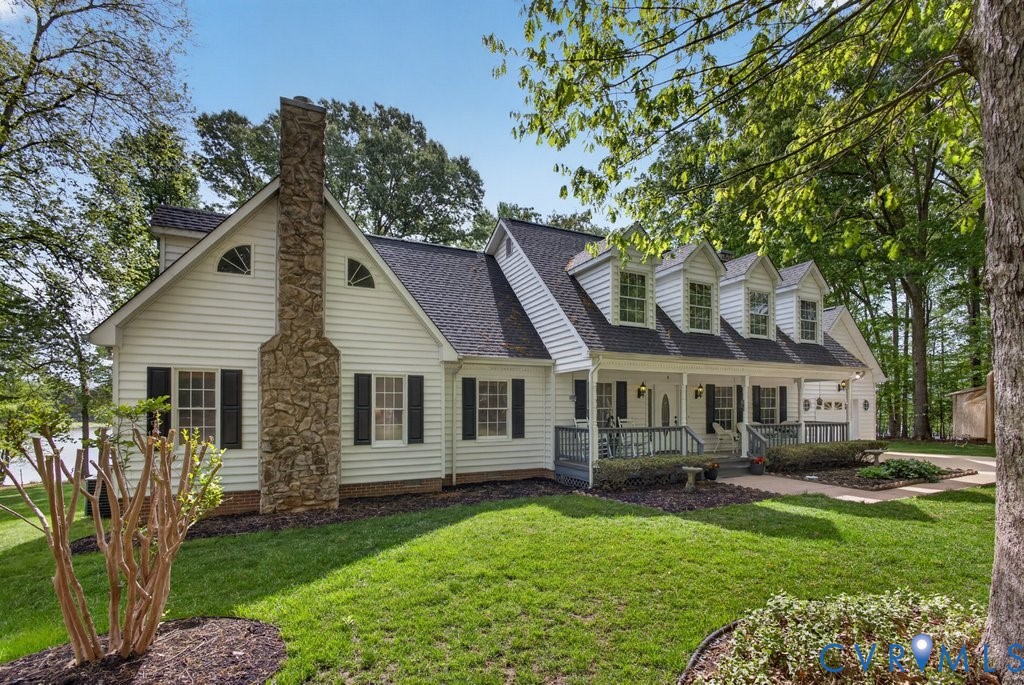 173 Covenant Way Bumpass, VA 23024 - Photo 3 of 55 a front view of a house with a garden