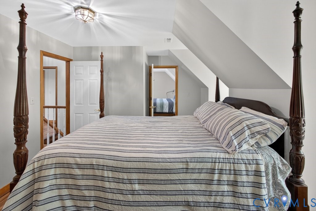 173 Covenant Way Bumpass, VA 23024 - Photo 38 of 55 This bedroom features a vaulted ceiling, a flush m