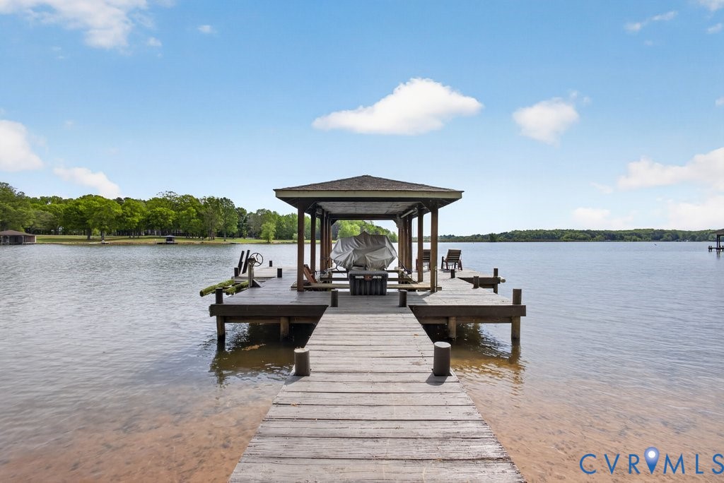 173 Covenant Way Bumpass, VA 23024 - Photo 43 of 55 Private dock with a covered boat slip and seating