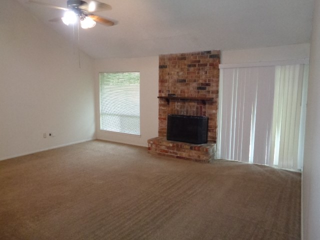 9530 Magnolia Ridge Drive Houston, TX 77070 - Photo 15 of 20 a view of a livingroom with an empty space and a fireplace