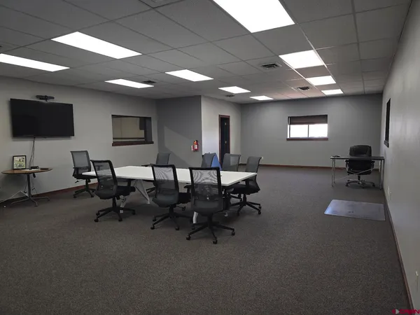 a view of a workspace with furniture